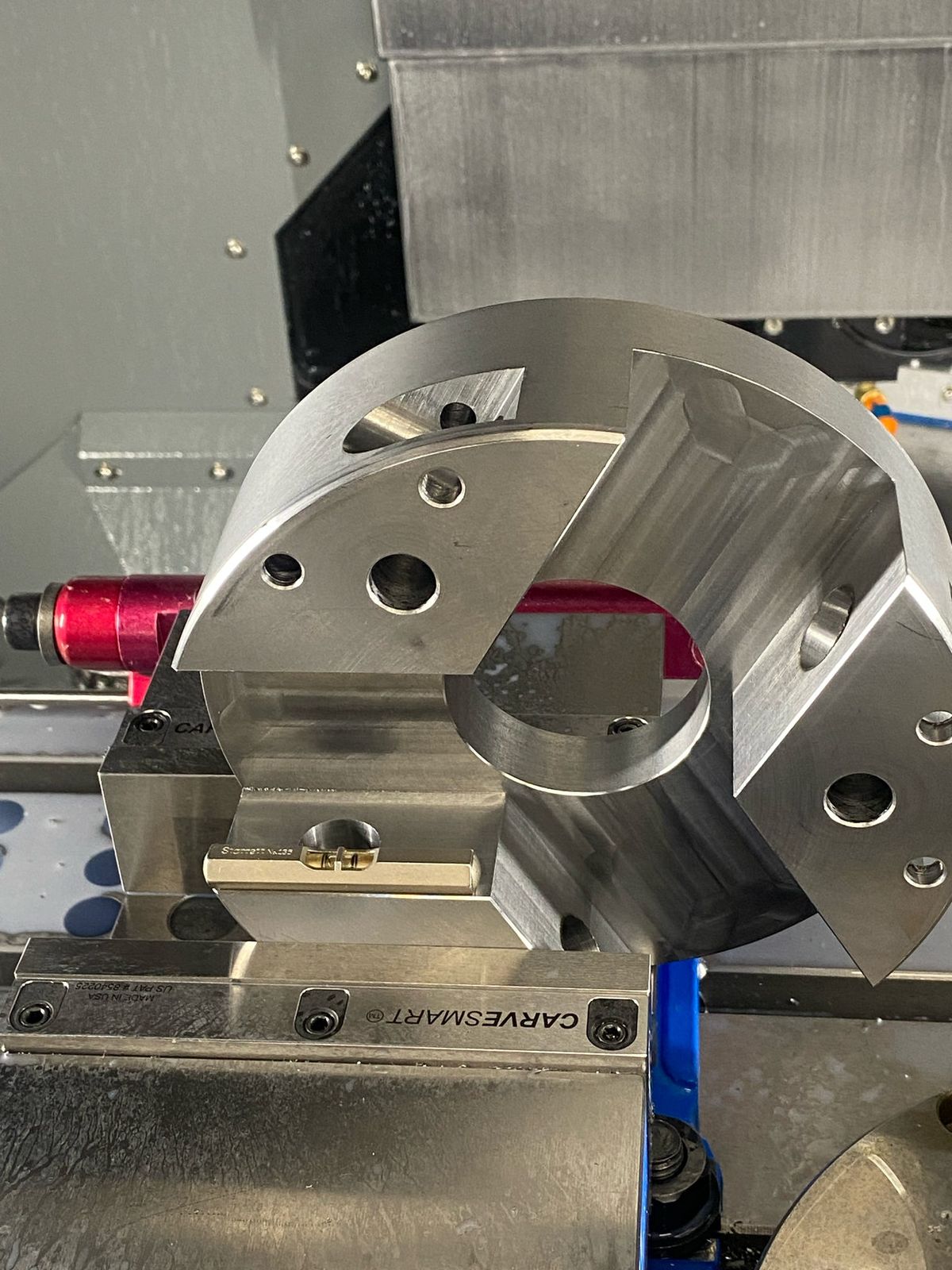 Round part held in a 5-axis vise