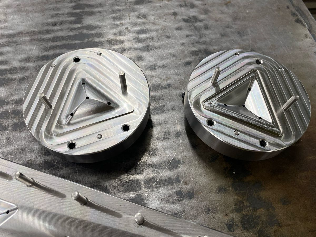 Two discs with triangular milled pockets